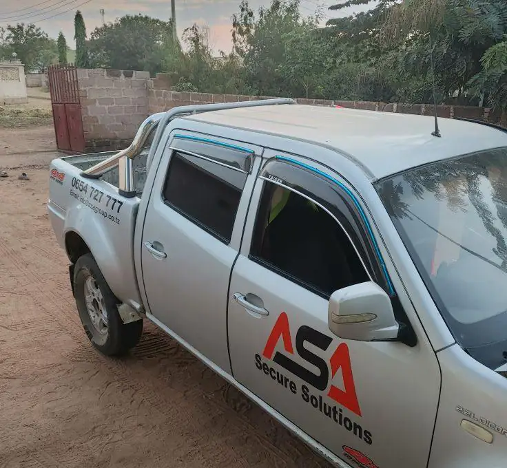 Silver response pickup with ASA Secure Solutions livery on the door