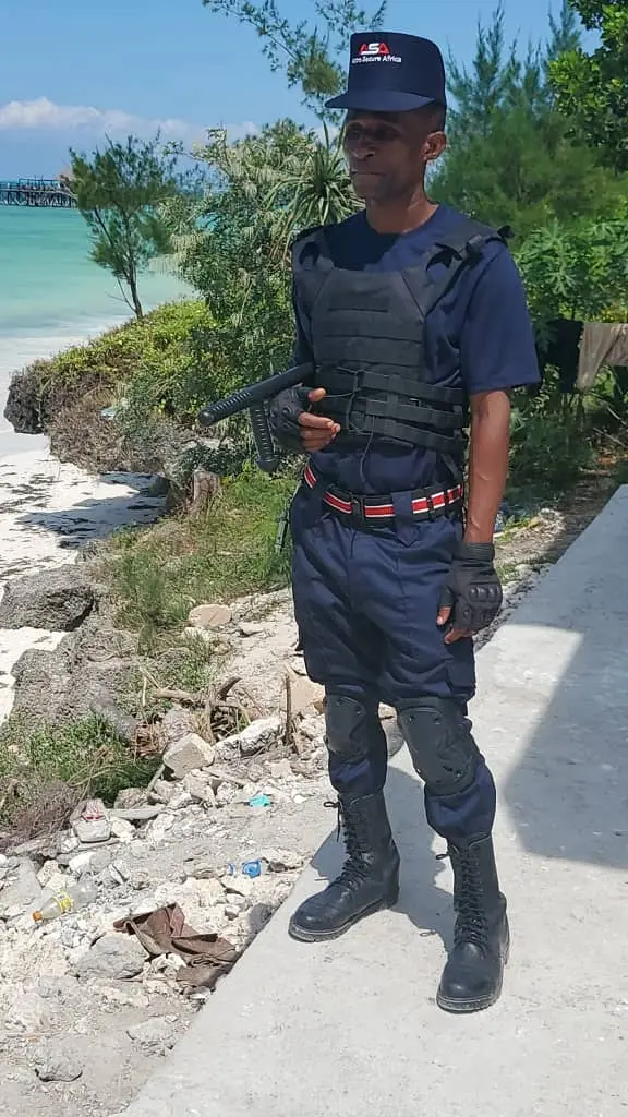 ASA Secure Solutions — guarding female officer desert site