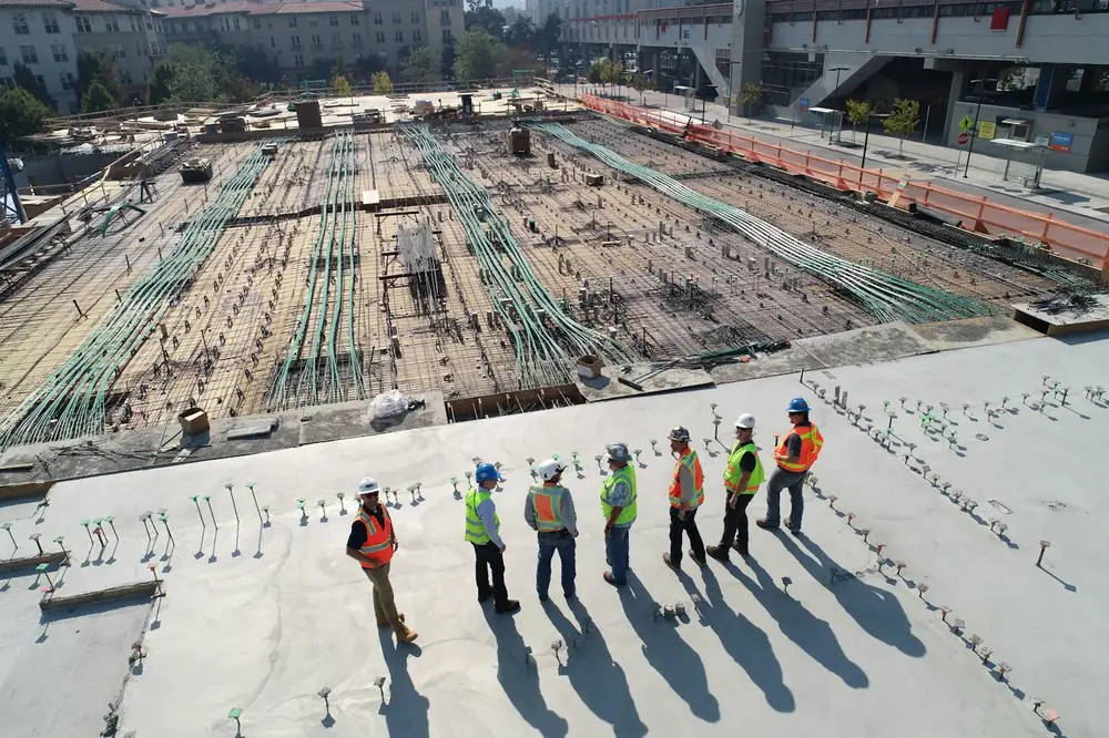 Construction team in high-visibility vests on a building site